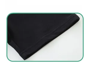 Detail of flat double-needle stitching on black knit cotton shorts hemline