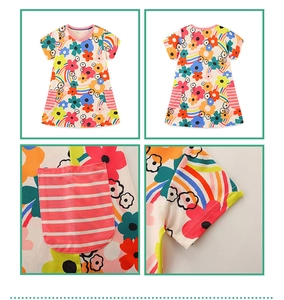 Detail view of cotton floral girls dress featuring rainbow prints and pink striped pockets