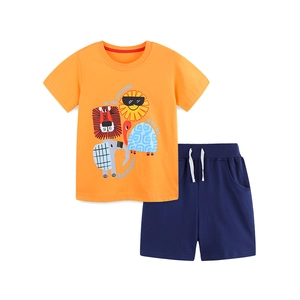 Summer kids set with bright orange cartoon printed t-shirt and blue sporty shorts