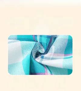 Detailed close-up of blue and white plaid cotton fabric showing soft woven texture