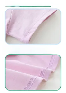 Detail view showing precision double-needle stitching on pink cotton girl dress hem