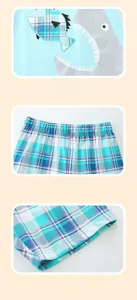 Detail of shark embroidery and elastic plaid shorts on boys summer cotton outfit
