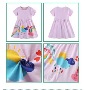 Detail of lilac cotton dress showing vibrant cartoon rainbow and floral prints on fabric