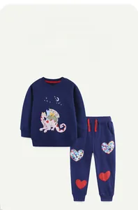 Detail of navy cotton kids sweatshirt with cartoon dragon and heart patch joggers