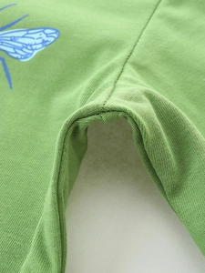 Grass green knit cotton long-sleeved kids' top featuring blue insect print and reinforced seams
