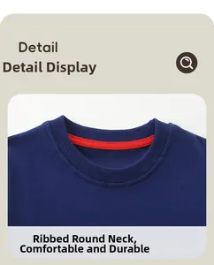 Detail of boys' navy crew neck sweatshirt featuring ribbed collar and orange neck tape