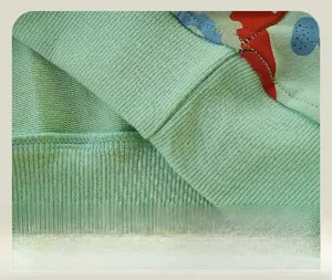 Detailed close-up of ribbed hem and French terry lining on printed children's sweatshirt