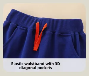 Detail of kids navy blue knit pants with elastic waistband and orange drawstring