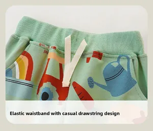 Detail of kids cotton joggers with elastic waistband, drawstring and colorful cartoon prints