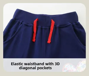 Detail of navy knit pants featuring elastic waistband and red decorative drawstring