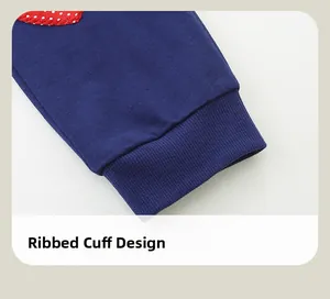 Detail view of ribbed cuffs on navy blue toddler joggers with cute heart embroidery
