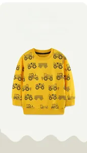 Close-up of yellow cotton sweatshirt featuring black tractor and construction car prints