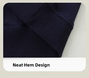 Detailed close-up of navy blue hoodie hem featuring ribbed cuffs and neat double stitching