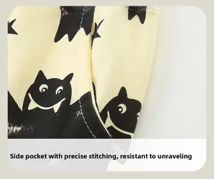 Close-up of boys' sports pants featuring bat prints and a reinforced side pocket