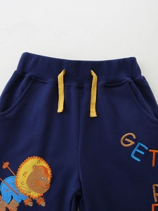 Kids navy blue sweatpants featuring cartoon lion embroidery and yellow drawstring