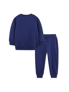 Ensemble sweat-shirt enfant bleu marine avec broderie dinosaure et bords-côtes sur fond blanc