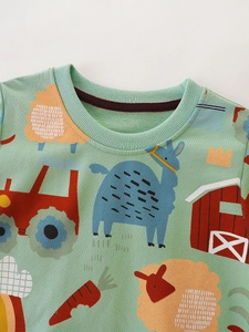 Kids mint green sweatshirt featuring cartoon farm animals and tractor print patterns