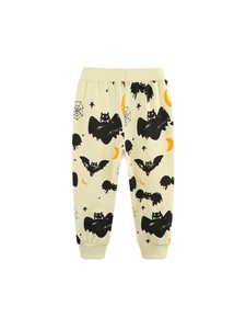 Kids Halloween sweatpants with bat and moon prints in cream yellow and elastic cuffs