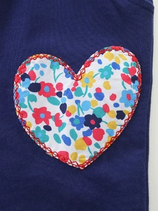 Girl's navy blue autumn sweater set with floral heart applique and red stitching details