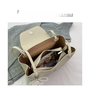 Top view of cream white leather tote bag interior with large capacity and zip compartment
