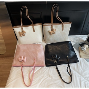 Selection of large capacity faux leather tote bags in four colors with dog charms