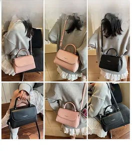 Detail shots of pink and black crossbody bag in lychee pattern faux leather