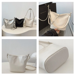Detailansicht stilvoller Beuteltaschen in Silber, Schwarz und Beige aus weichem PU-Leder