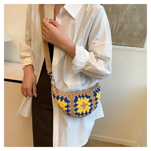 Detail of bohemian crochet sunflower crossbody bag worn on a model in a minimal room