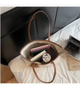Interior view of large capacity tote bag showing space for tablets and books