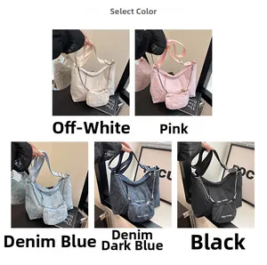 Detail showing various colors of pleated canvas tote bags with mini pouch and embroidery