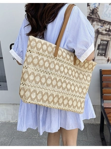 Large woven straw tote bag with brown geometric patterns for summer beach travel