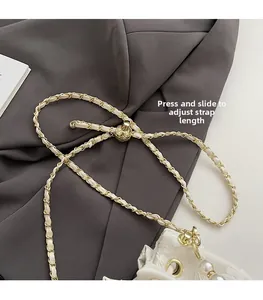 Close-up of beige leather chain strap with adjustable gold ball and pearl pendant