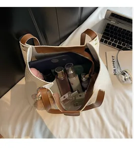Detailed interior of a white crocodile pattern tote bag showing spacious capacity and storage