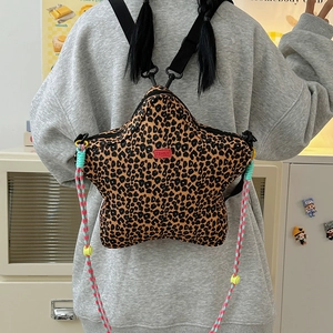 Detail of star-shaped leopard print backpack with ZSHILY logo and woven drawstring