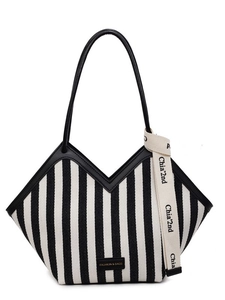 Striped canvas tote bag with V-shaped opening, black leather straps and decorative ribbon