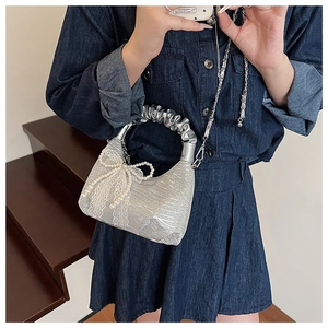 Silver pleated handbag with chain strap, lace lace and pearl bow accent detail
