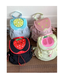 Detail view of four colorful lightweight nylon backpacks with cartoon fruit designs