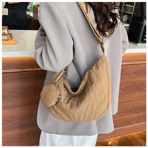 Detail of khaki pleated crescent crossbody bag with matching round coin purse pouch