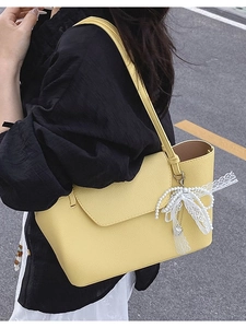 Yellow pebbled leather tote bag for women with pearl and lace bow charm accessory