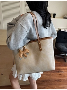 Minimalist crocodile texture tote bag with brown straps and cute dog charm for women