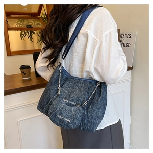 Blue denim shoulder bag with pleated design and Happy Sunday embroidery detail
