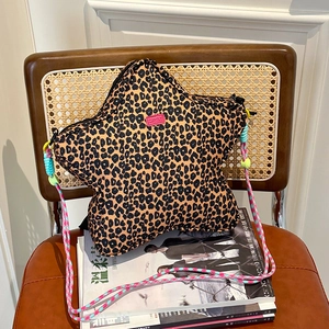 Star-shaped leopard print shoulder bag with colorful woven strap and pink brand label