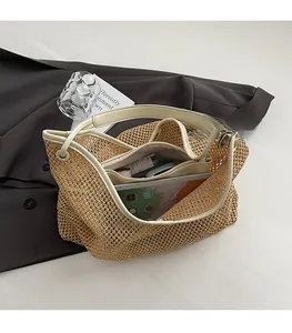 Detailed view of spacious interior of a straw tote bag with cream leather trim