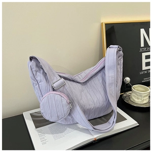 Detail of light purple pleated hobo bag with a matching small round coin purse