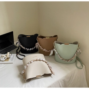 Litchi pattern bucket bags in four colors with silk scarf handles and chain detail