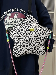 Star shaped leopard print crossbody bag with colorful rope strap and green logo label