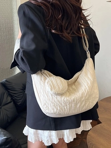 Cream white crossbody crescent bag with wide strap and mini coin purse in street style