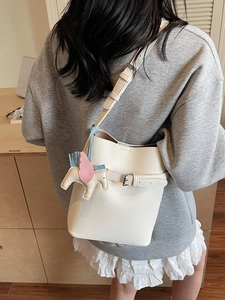 White lychee texture bucket bag for women with cute unicorn charm and adjustable strap