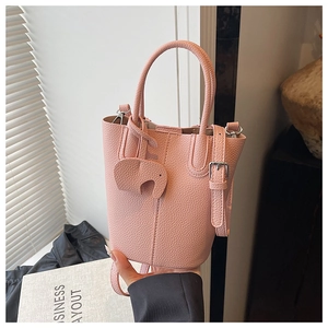 Pink bucket bag with lychee texture featuring a cute elephant charm and silver buckle
