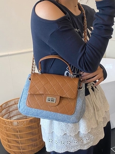 Quilted crossbody bag with blue glitter and brown leather details for women
